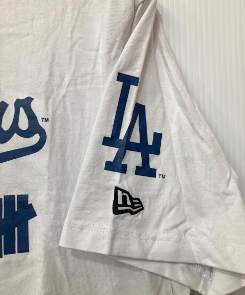 UNDEFEATED（アンディフィーテッド）UNDEFEATED (アンディフィーテッド) LA DODGERS (ロサンゼルス・ドジャース) New Era (ニューエラ) プリントTシャツ ホワイト×ブルー サイズ:XLの古着・服飾アイテム