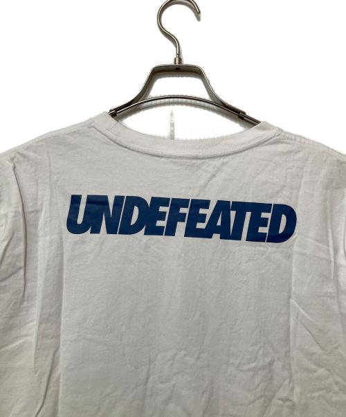 UNDEFEATED（アンディフィーテッド）UNDEFEATED (アンディフィーテッド) LA DODGERS (ロサンゼルス・ドジャース) New Era (ニューエラ) プリントTシャツ ホワイト×ブルー サイズ:XLの古着・服飾アイテム