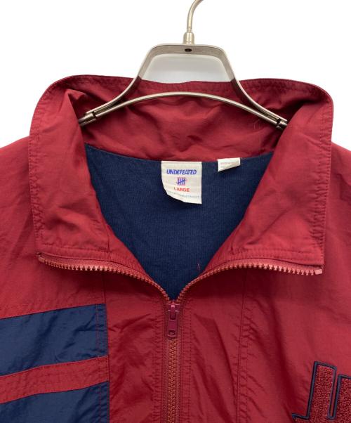 UNDEFEATED（アンディフィーテッド）UNDEFEATED (アンディフィーテッド) ジップアップジャケット レッド×ネイビー サイズ:Lの古着・服飾アイテム