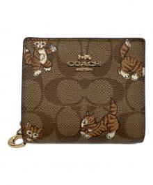 COACH（コーチ）の古着「スナップウォレット」｜ブラウン