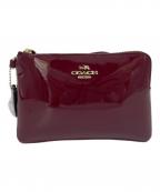 COACHコーチ）の古着「エナメルポーチ」｜ボルドー