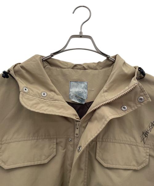 stussy（ステューシー）stussy (ステューシー) ナイロンマウンテンパーカー ベージュ サイズ:Lの古着・服飾アイテム