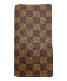 LOUIS VUITTON（ルイ ヴィトン）の古着「2つ折り財布」｜ブラウン