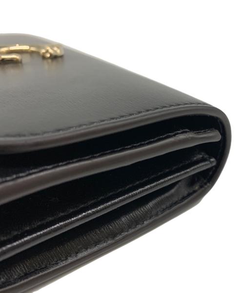 Cartier（カルティエ）Cartier (カルティエ) フラップ付インターナショナル ウォレット ブラックの古着・服飾アイテム