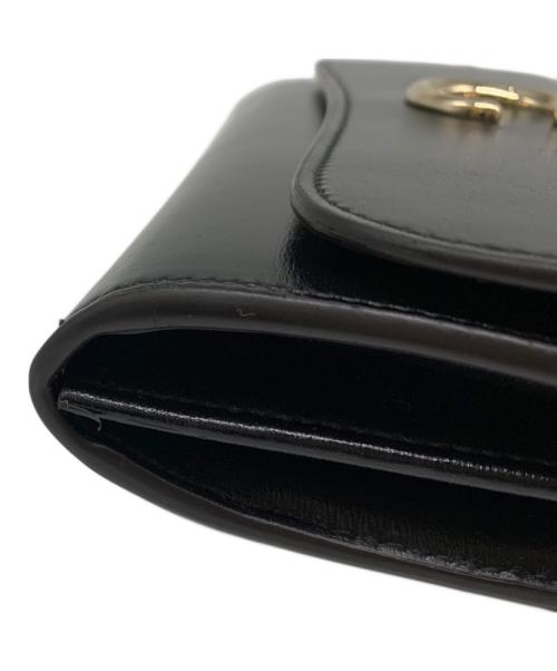 Cartier（カルティエ）Cartier (カルティエ) フラップ付インターナショナル ウォレット ブラックの古着・服飾アイテム