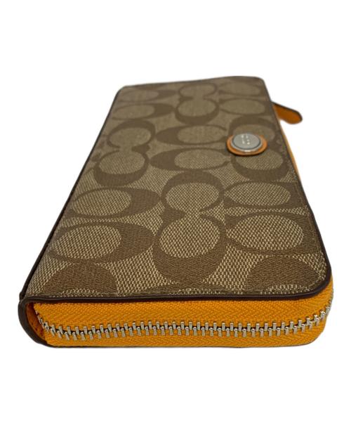 COACH（コーチ）COACH (コーチ) COACH　ラウンドファスナー財布 ベージュ×オレンジの古着・服飾アイテム