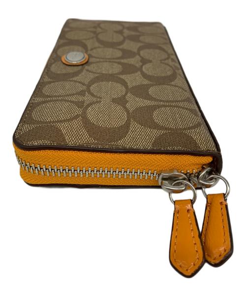 COACH（コーチ）COACH (コーチ) COACH　ラウンドファスナー財布 ベージュ×オレンジの古着・服飾アイテム