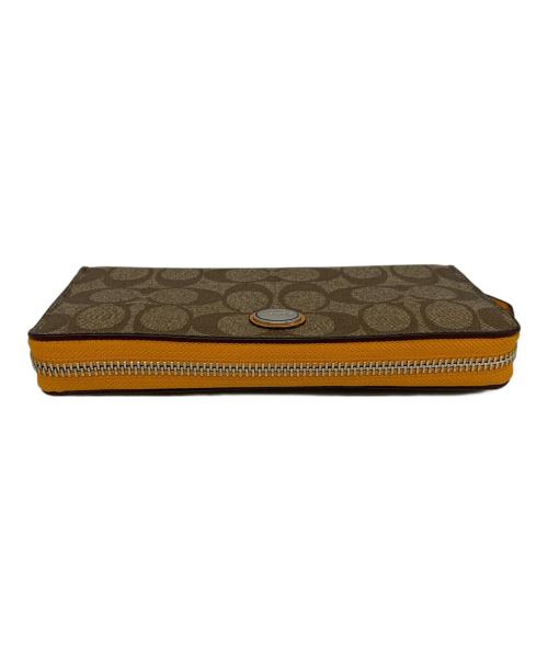 COACH（コーチ）COACH (コーチ) COACH　ラウンドファスナー財布 ベージュ×オレンジの古着・服飾アイテム