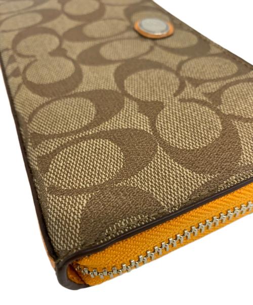 COACH（コーチ）COACH (コーチ) COACH　ラウンドファスナー財布 ベージュ×オレンジの古着・服飾アイテム