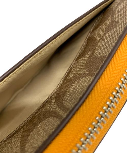 COACH（コーチ）COACH (コーチ) COACH　ラウンドファスナー財布 ベージュ×オレンジの古着・服飾アイテム