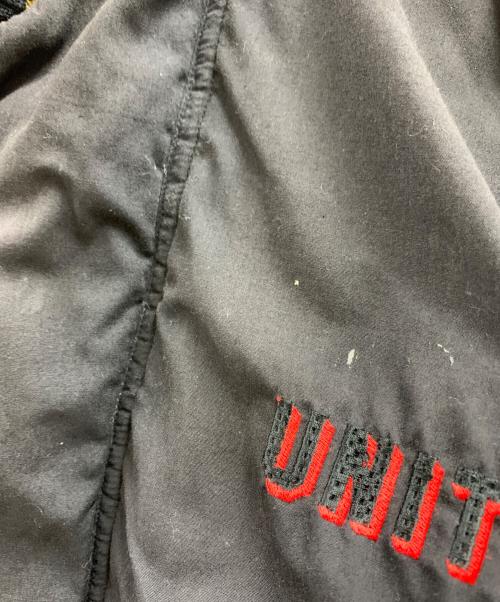 UMBRO（アンブロ）UMBRO (アンブロ) UMBRO　古着 マンチェスターユナイテッド　ブルゾン ブラック×レッド サイズ:Mの古着・服飾アイテム