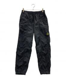 STONE ISLAND（ストーンアイランド）の古着「ナイロンパンツ」｜ブラック