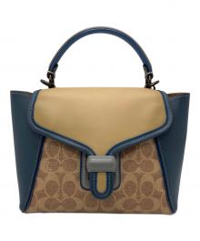COACH（コーチ）の古着「COACH　クーリエ キャリーオール　　2WAYバッグ」｜ベージュ×ブルー
