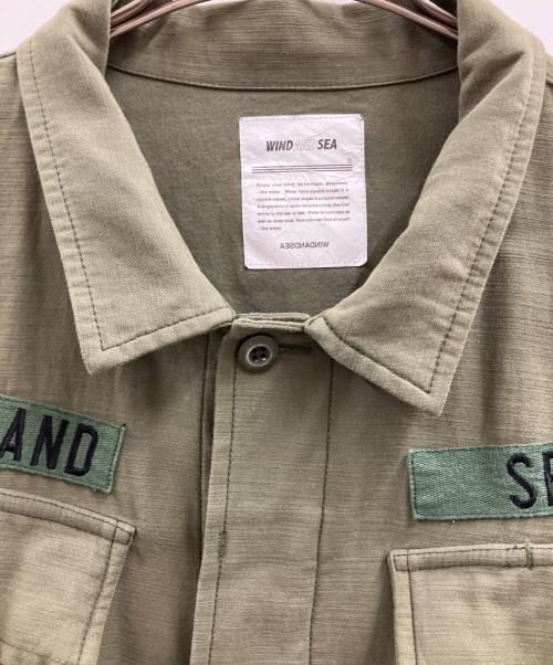 WIND AND SEA（ウィンダンシー）WIND AND SEA (ウィンダンシー) WIND AND SEA　Band Jungle Fatigue Jacket オリーブ サイズ:XLの古着・服飾アイテム