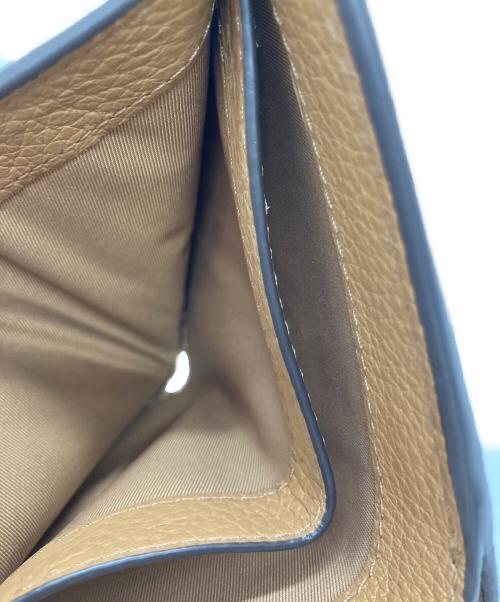 TORY BURCH（トリーバーチ）TORY BURCH (トリーバーチ) TORY BURCH　2つ折り財布 ベージュの古着・服飾アイテム