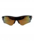 OAKLEYオークリー）の古着「サングラス」｜ブラック×ゴールド