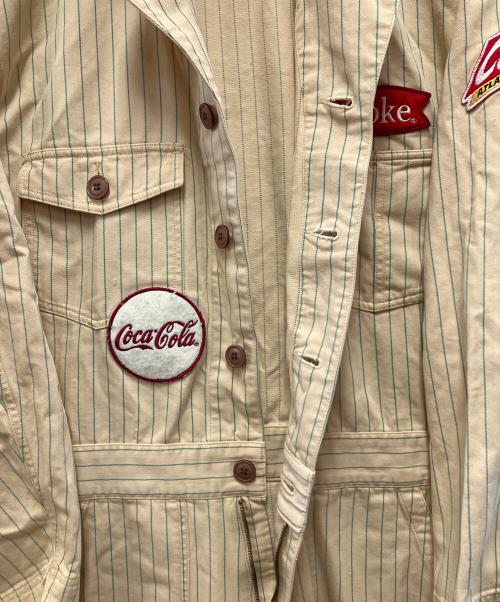 Coca Cola（コカコーラ）Coca Cola (コカコーラ) つなぎ ベージュ サイズ:Lの古着・服飾アイテム