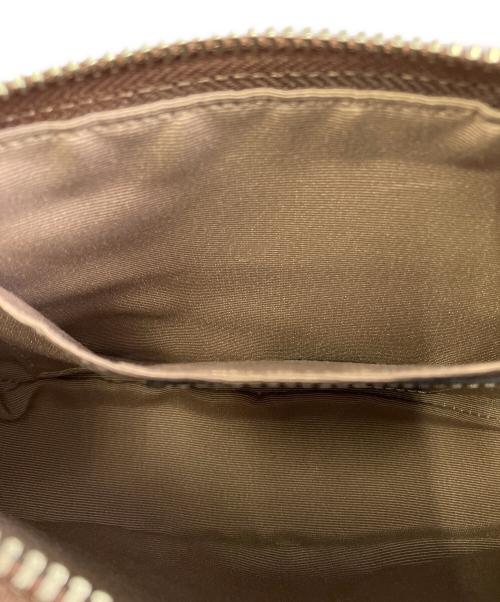 COACH（コーチ）COACH (コーチ) ハンドポーチ レッド×ブラウンの古着・服飾アイテム