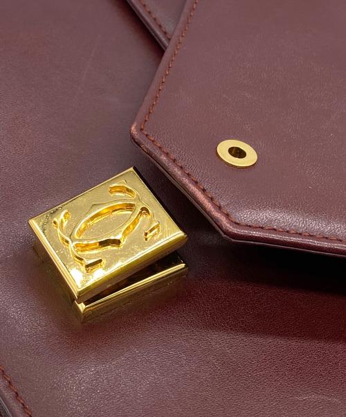 must de cartier（マストドゥカルティエ）must de cartier (マストドゥカルティエ) レザーフラップショルダーバッグ ワインレッドの古着・服飾アイテム