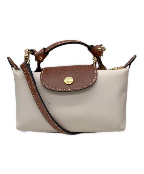 LONGCHAMP（ロンシャン）LONGCHAMP (ロンシャン) ハンドル付きポーチ ベージュ×ブラウンの古着・服飾アイテム