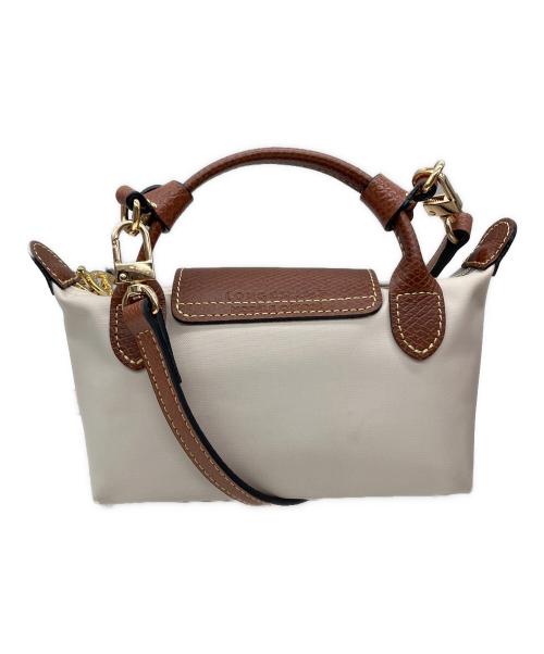 LONGCHAMP（ロンシャン）LONGCHAMP (ロンシャン) ハンドル付きポーチ ベージュ×ブラウンの古着・服飾アイテム