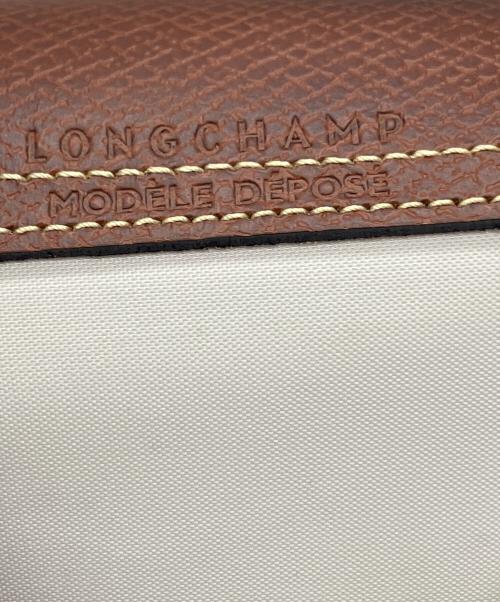 LONGCHAMP（ロンシャン）LONGCHAMP (ロンシャン) ハンドル付きポーチ ベージュ×ブラウンの古着・服飾アイテム