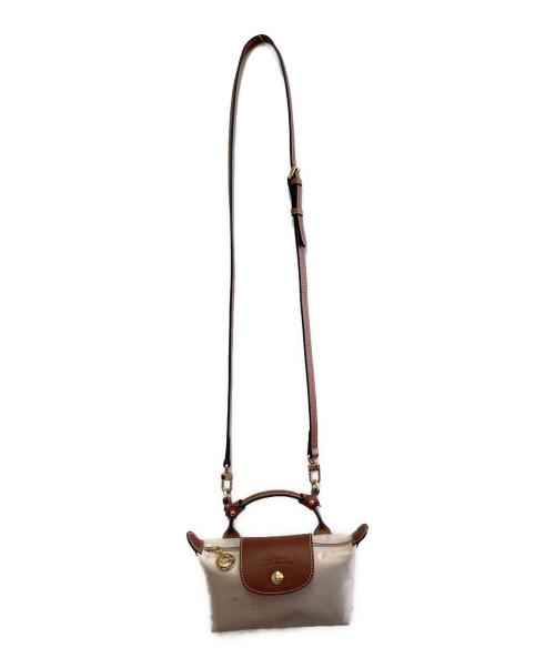 LONGCHAMP（ロンシャン）LONGCHAMP (ロンシャン) ハンドル付きポーチ ベージュ×ブラウンの古着・服飾アイテム