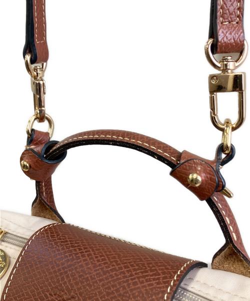 LONGCHAMP（ロンシャン）LONGCHAMP (ロンシャン) ハンドル付きポーチ ベージュ×ブラウンの古着・服飾アイテム