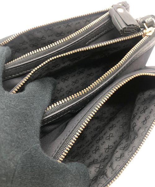 ANYA HINDMARCH（アニヤ・ハインドマーチ）ANYA HINDMARCH (アニヤハインドマーチ) ウォレットポーチ ブラックの古着・服飾アイテム