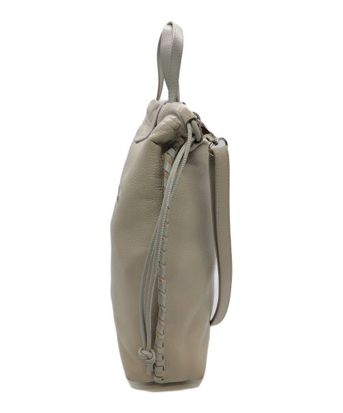 ear PAPILLONNER（イアパピヨネ）ear PAPILLONNER (イアパピヨネ) バックル巾着ショルダーバッグ ベージュの古着・服飾アイテム