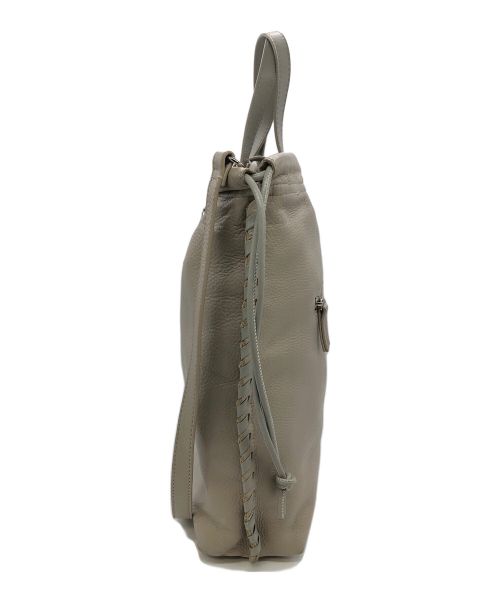 ear PAPILLONNER（イアパピヨネ）ear PAPILLONNER (イアパピヨネ) バックル巾着ショルダーバッグ ベージュの古着・服飾アイテム