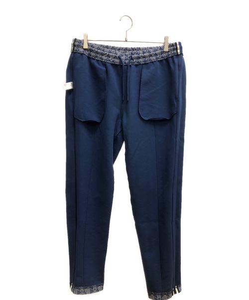 LACOSTE（ラコステ）LACOSTE (ラコステ) サイドテーピングモノグラムジャカードトラックパンツ ブルー×ホワイト サイズ:SIZE L(US)の古着・服飾アイテム