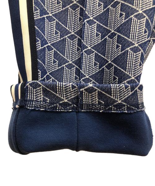 LACOSTE（ラコステ）LACOSTE (ラコステ) サイドテーピングモノグラムジャカードトラックパンツ ブルー×ホワイト サイズ:SIZE L(US)の古着・服飾アイテム