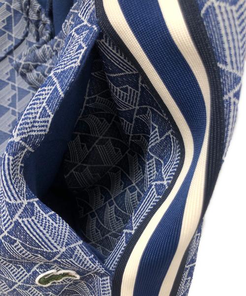 LACOSTE（ラコステ）LACOSTE (ラコステ) サイドテーピングモノグラムジャカードトラックパンツ ブルー×ホワイト サイズ:SIZE L(US)の古着・服飾アイテム