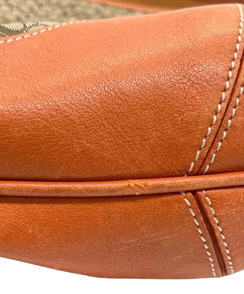 COACH（コーチ）COACH (コーチ) ミニシグネチャー　ハンドバッグ オレンジの古着・服飾アイテム