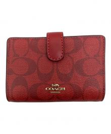 COACH（コーチ）の古着「シグネチャー 2つ折り財布」｜レッド