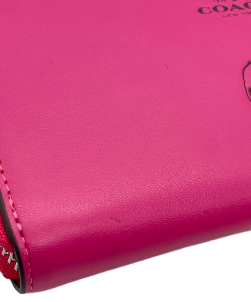 COACH（コーチ）COACH (コーチ) PEANUTS (ピーナッツ) ラウンドファスナーウォレット ピンクの古着・服飾アイテム