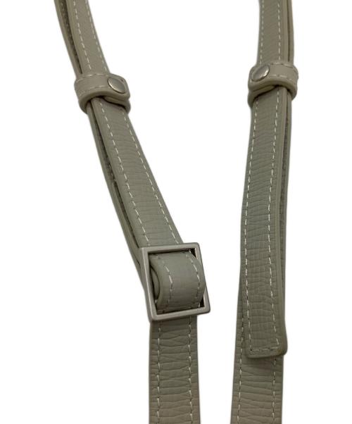 objects.io（オブジェクトアイオー）objects.io (オブジェクトアイオー) レザーストラップ付iPhoneアクセサリー カードケース カーキの古着・服飾アイテム