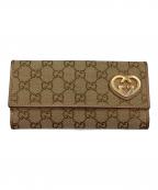 GUCCIグッチ）の古着「ラブリーハート　長財布」｜ベージュ×ピンクゴールド
