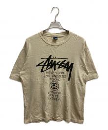 stussy（ステューシー）の古着「ワールドツアーT 半袖Tシャツ」｜ベージュ