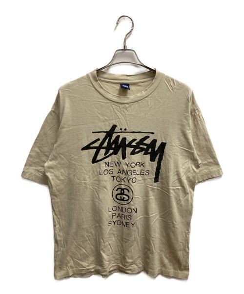stussy（ステューシー）stussy (ステューシー) ワールドツアーT 半袖Tシャツ ベージュ サイズ:SIZE Lの古着・服飾アイテム