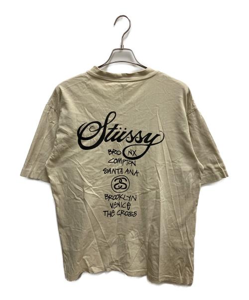 stussy（ステューシー）stussy (ステューシー) ワールドツアーT 半袖Tシャツ ベージュ サイズ:SIZE Lの古着・服飾アイテム