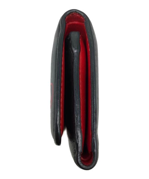 Christian Louboutin（クリスチャン・ルブタン）Christian Louboutin (クリスチャン・ルブタン) 3つ折り財布 ブラック×レッドの古着・服飾アイテム