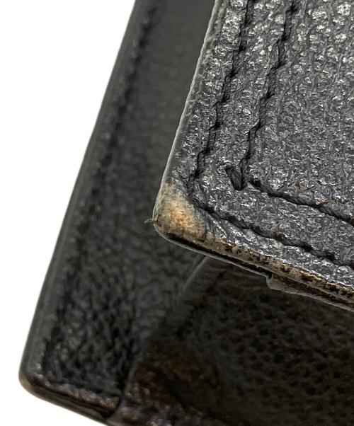 Yves Saint Laurent（イヴサンローラン）Yves Saint Laurent (イヴサンローラン) クラッチバッグ ブラック×ゴールドの古着・服飾アイテム