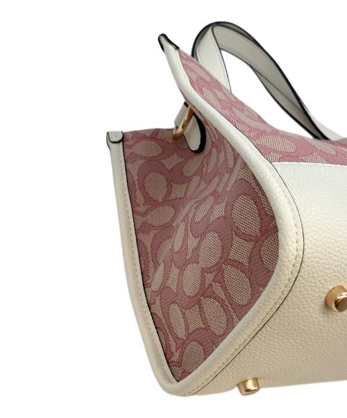 COACH（コーチ）COACH (コーチ) シグネチャー　デンプシーキャリーオール2way ショルダーバッグ ピンク×ホワイトの古着・服飾アイテム