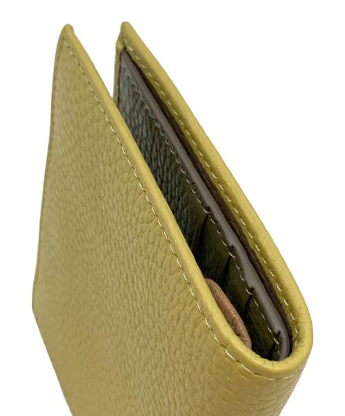 IACUCCI（イアクッチ）IACUCCI (イアクッチ) 2つ折り財布 イエローの古着・服飾アイテム