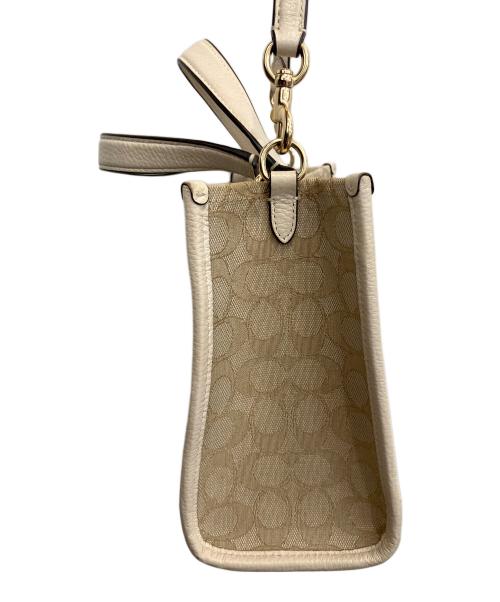 COACH（コーチ）COACH (コーチ) Dempsey Tote 22 ベージュの古着・服飾アイテム