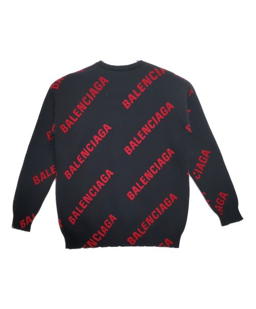BALENCIAGA（バレンシアガ）BALENCIAGA (バレンシアガ) 総柄BALENCIAGAスラッシュロゴ付クルーネックニット ブラック×レッド サイズ:XSの古着・服飾アイテム