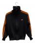 adidas（アディダス）の古着「トラックジャケット」｜ブラック×オレンジ