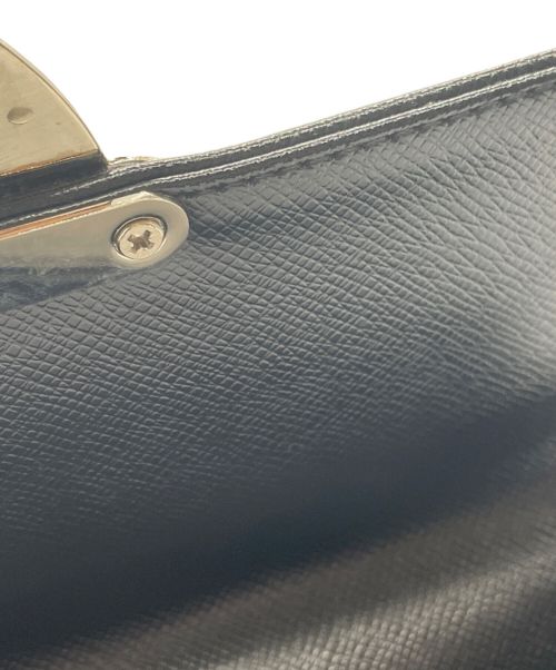 Yves Saint Laurent（イヴサンローラン）Yves Saint Laurent (イヴサンローラン) 型押しクラッチバッグ ブラックの古着・服飾アイテム